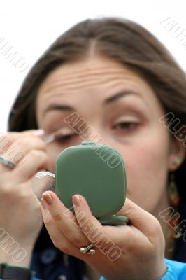applying make up - focus on hand