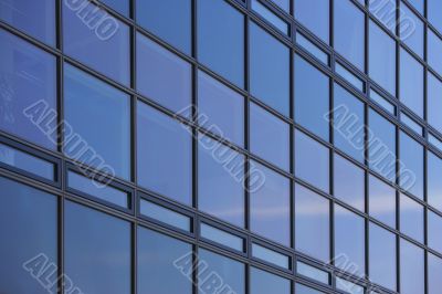 reflecting glass facade of a skyscraper
