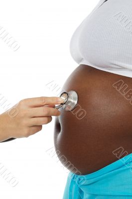 pregnant woman and stethoscope