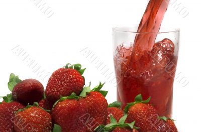 pouring fresh strawberry  juice