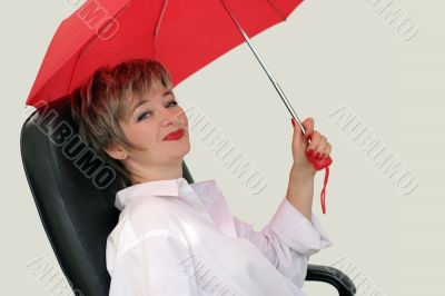Businesswoman with a red umbrella