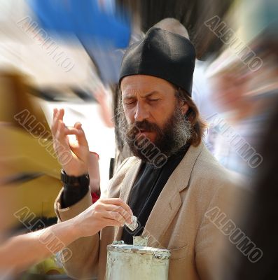 Russian orthodox monk gathering donation