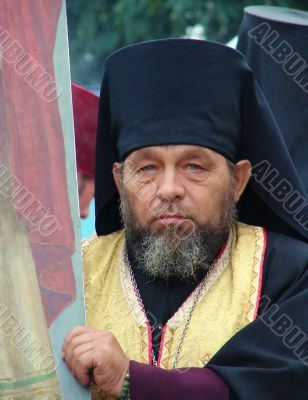 Ukranian Orthodox monk with banner