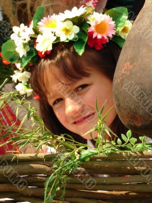 Cozy ukrainian baby girl with garland