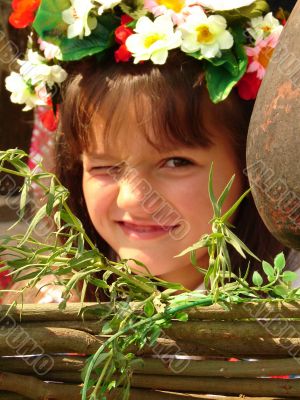 Cozy ukrainian baby girl with garland