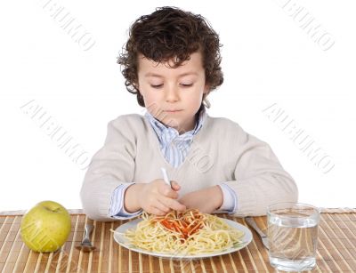 Adorable child hungry at the time of eating