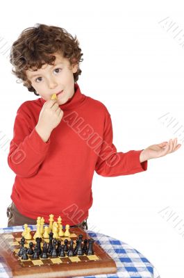 Adorable boy playing the chess