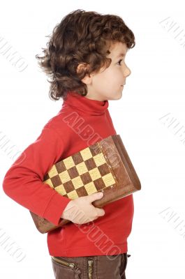 Adorable boy playing the chess