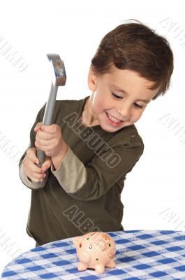 adorable boy breaking the money box