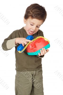 adorable boy speaking on the telephone