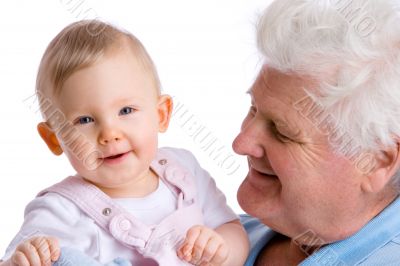 smiling baby with grandfather