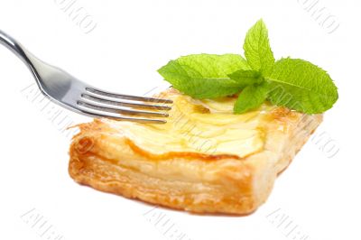 Fork and apple tart on a dish