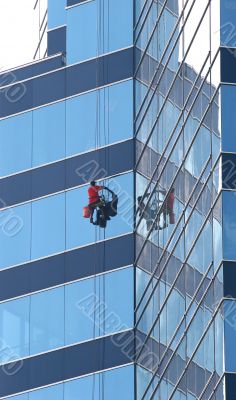 Window Washer on Blue Glass