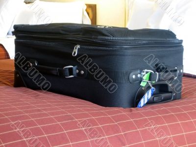 luggage in hotel room