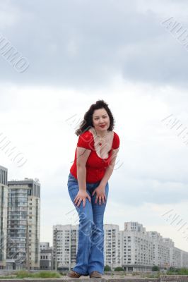 Woman in red shirt posing