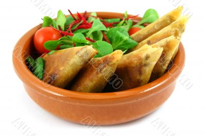samosas in a bowl