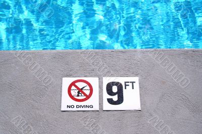 Swimming pool depth marker