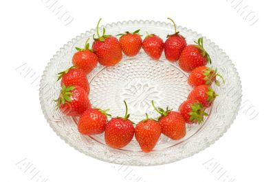 Strawberries on a glass dish, isolated on white