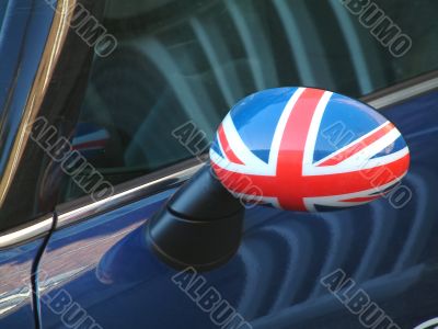 british car wing mirror with flag
