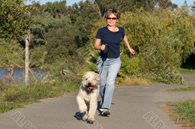 Woman running with her dog