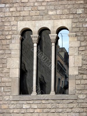 Ancient window of a cathedral . Barcelona