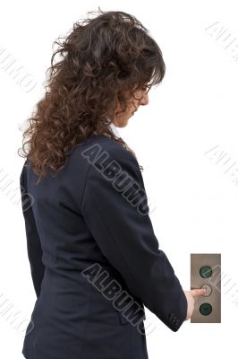 Woman pushing the button of elevator Woman pushing the button of elevator
