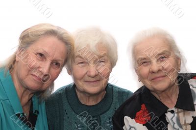 Three old women smiling