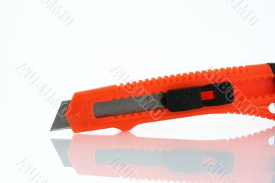 Orange razor knife reflection