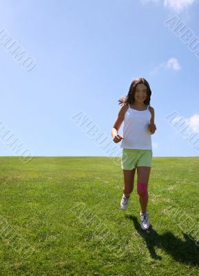 Girl running on grass