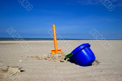 Beach spade and bucket