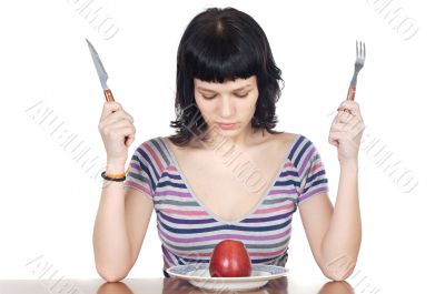 girl watching a red apple