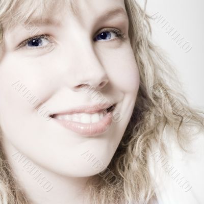 Portrait of a beautifull curly blond