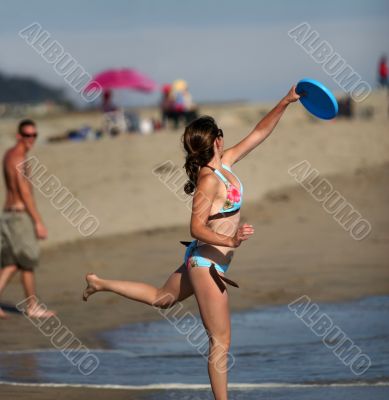 Girl playing frisbee