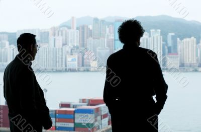 Two businessmen looking out of the window