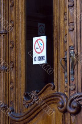 Opening door with no-smoking sign
