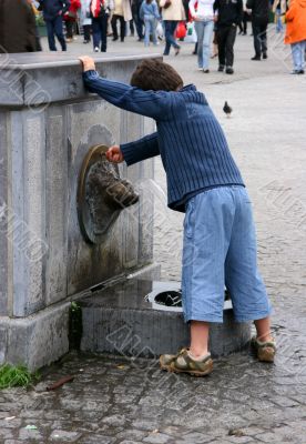 curious kid with fountain
