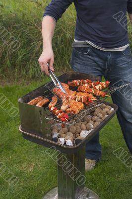 turning meat on barbecue
