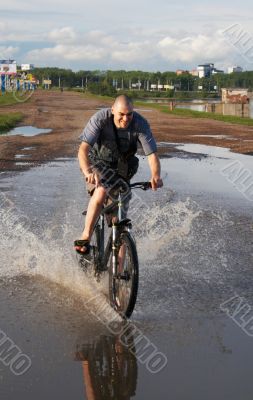 biker crossing the water