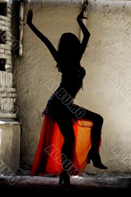 Woman dancing belly-dance in Oriental costume