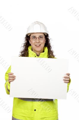 Female construction worker showing a blank banner