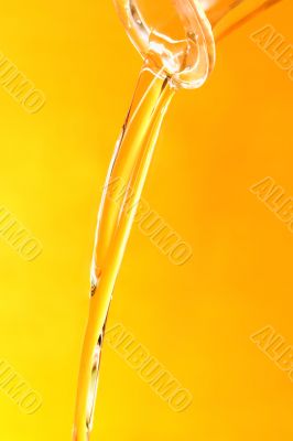 Jet of oil on a yellow background