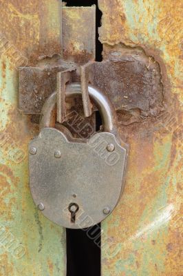 Wintage rusty metal gate padlock
