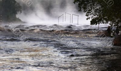 Morning fog above a river threshold