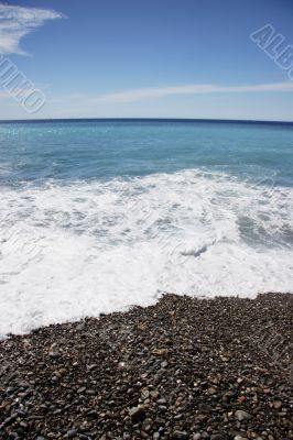 Water lapping on the beach - portrait