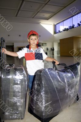 boy with baggage in the airport