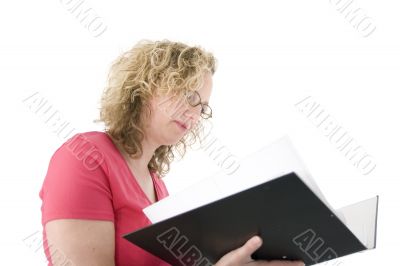 Attractive blonde with glasses checking a folder