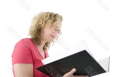 Attractive blonde with glasses checking a folder Attractive blonde with glasses checking a folder