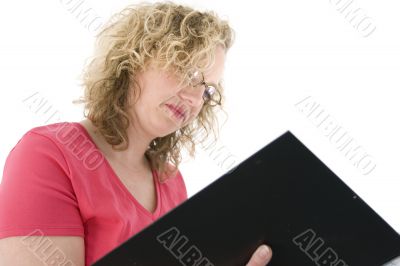 Attractive blonde with glasses checking a folder