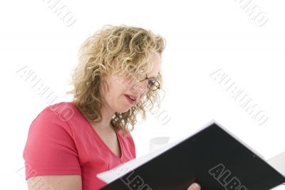 Attractive blonde with glasses checking a folder