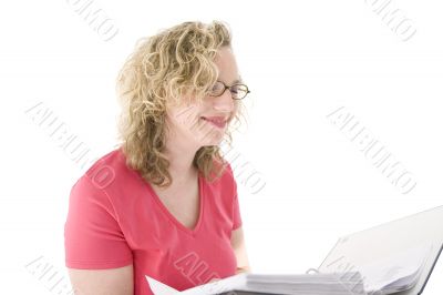 Attractive blonde with glasses checking a folder